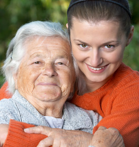 Young woman embracing her grandmother